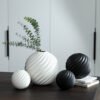 Black and white round ceramic vase for Wabi-Sabi home décor, available for wholesale.