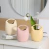 Wholesale ceramic bag vase for Nordic home décor and floral arrangements.