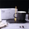 Wholesale geometric ceramic coffee mug and saucer with gold detailing.