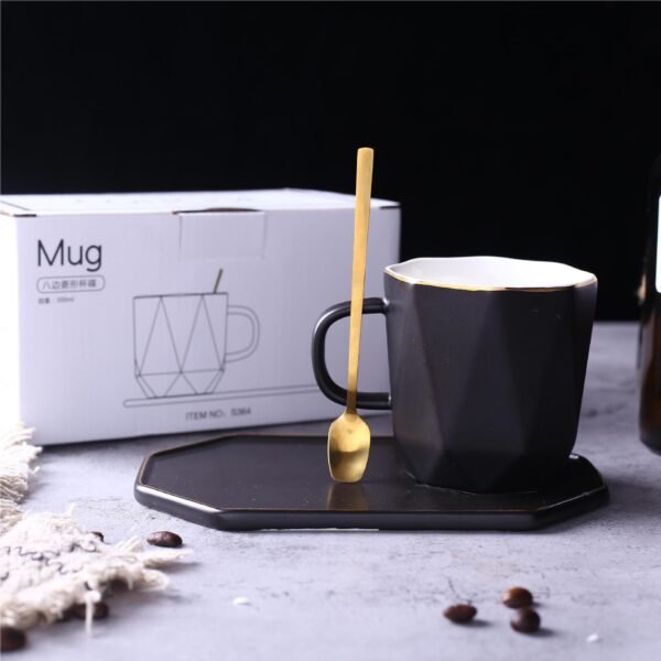 Wholesale geometric ceramic coffee mug and saucer with gold detailing.