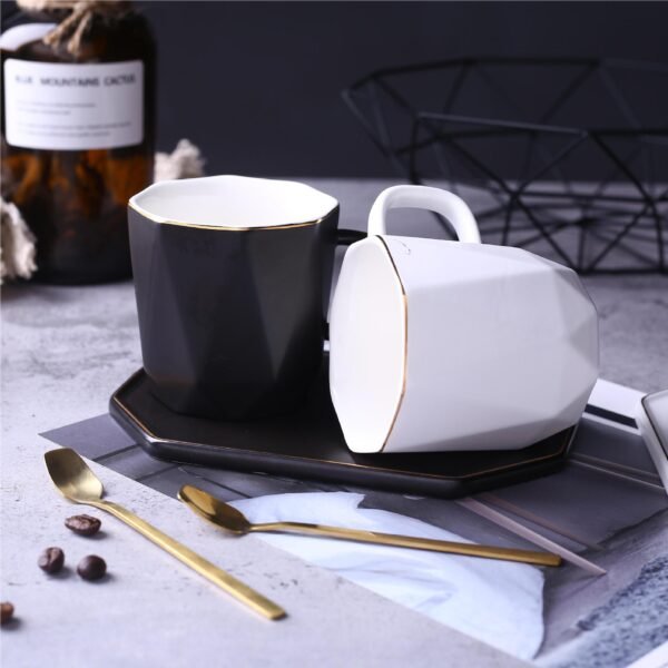 Geometric ceramic tea cup with gilded saucer.