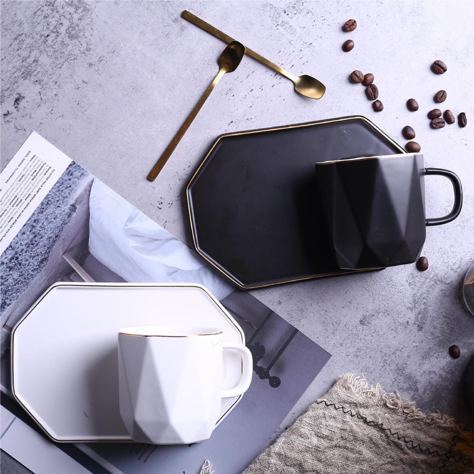 Wholesale geometric ceramic tea cup with gold accents and saucer.