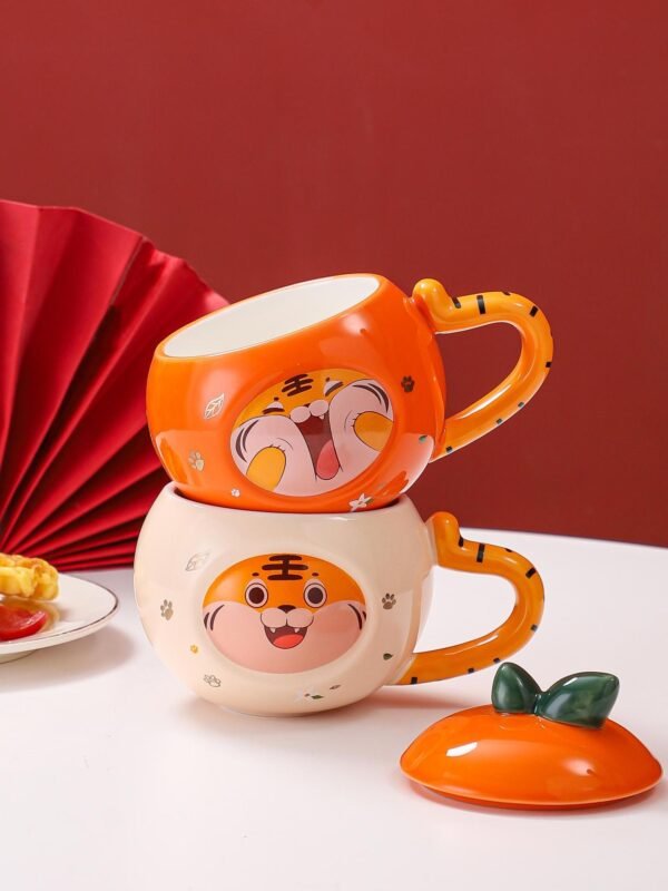 Fun ceramic mug with a cartoon tiger lid and handle, ideal for everyday use.