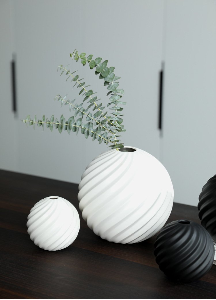 Black and white round ceramic vase for home and office décor.