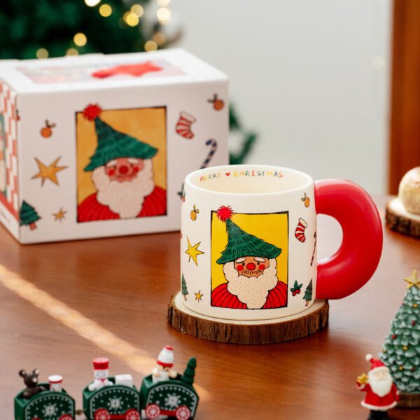 Festive ceramic coffee cup with Santa and gift designs